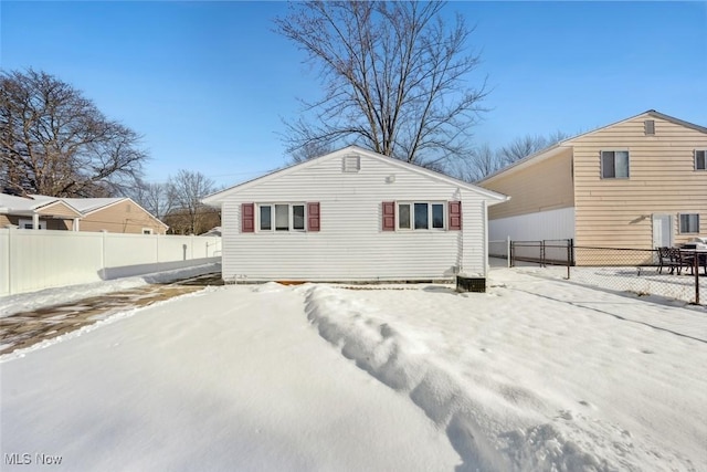 view of snow covered house