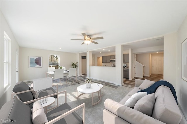 living room featuring ceiling fan