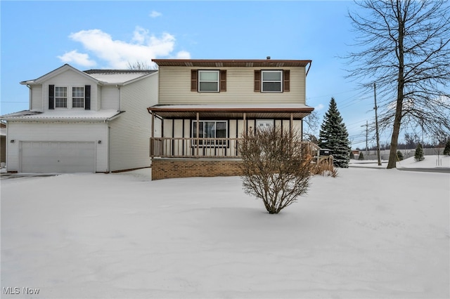 view of front property with a garage and a porch