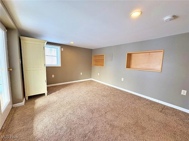 unfurnished room featuring carpet floors