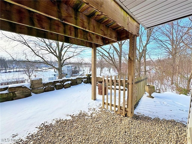 view of yard layered in snow