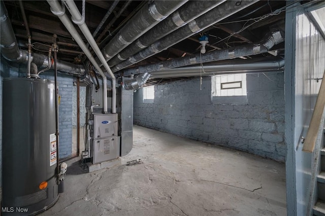 basement featuring heating unit and gas water heater