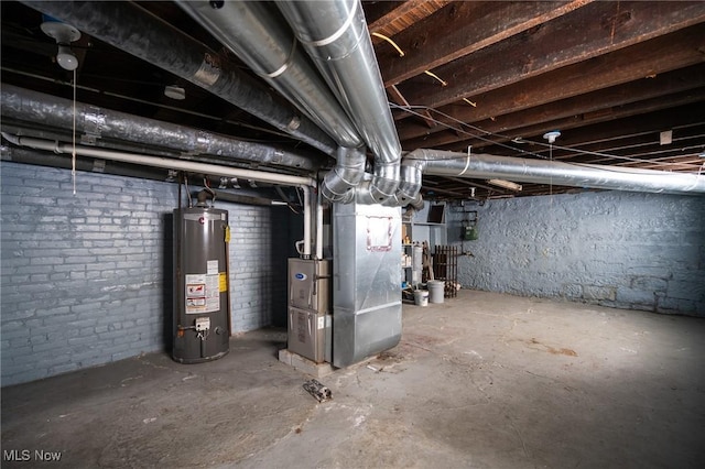 basement with water heater and heating unit