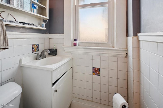 bathroom with toilet and vanity