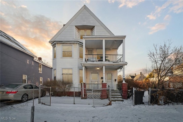 view of front of home with a balcony and covered porch