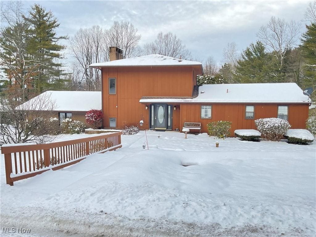 view of snow covered house