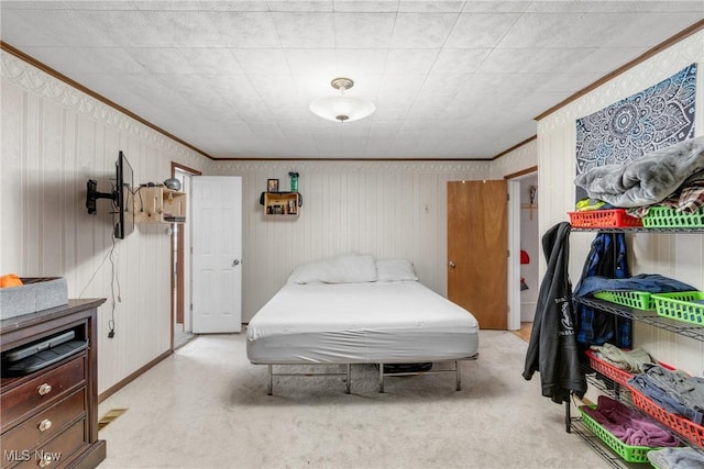 carpeted bedroom featuring ornamental molding