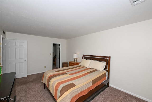 bedroom with dark carpet