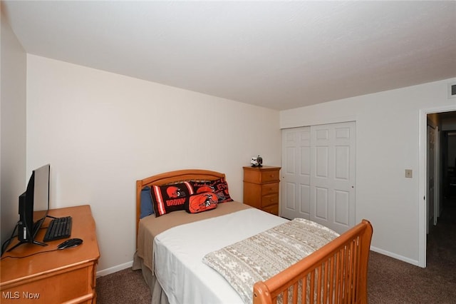 carpeted bedroom featuring a closet