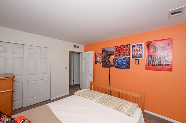 carpeted bedroom with a closet