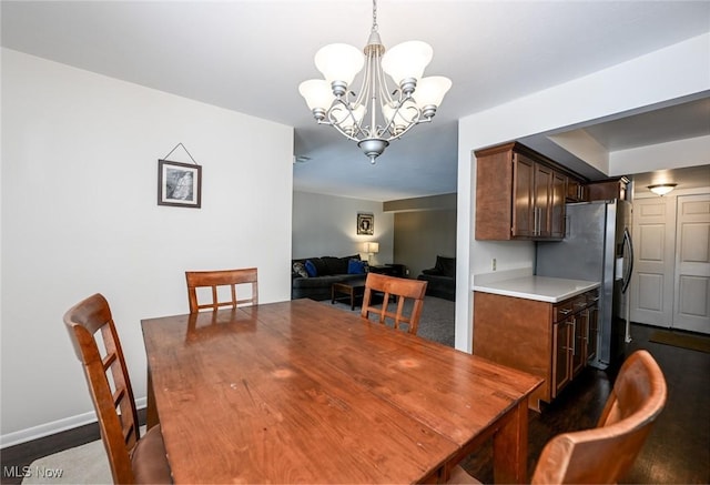 dining area featuring an inviting chandelier