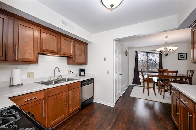 kitchen with stainless steel dishwasher, hanging light fixtures, an inviting chandelier, dark hardwood / wood-style flooring, and sink