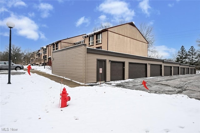 view of snow covered garage