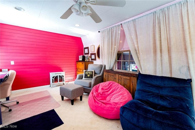 carpeted office space featuring ceiling fan