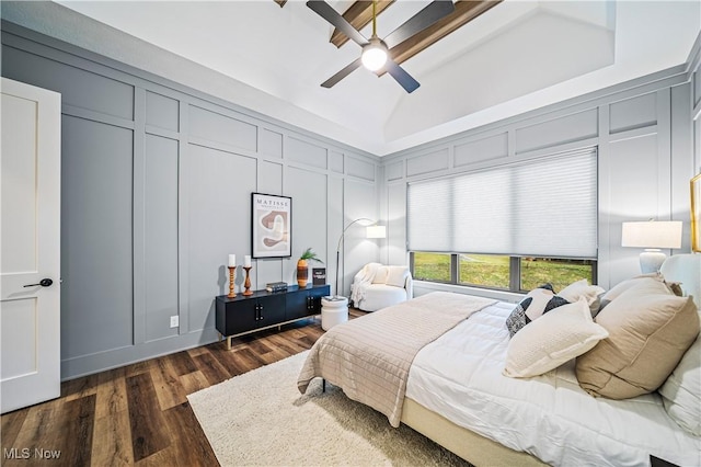 bedroom with vaulted ceiling, a raised ceiling, ceiling fan, and dark hardwood / wood-style floors