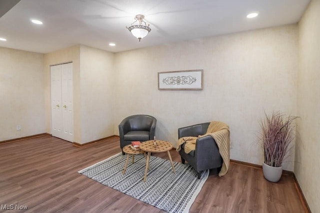 sitting room with hardwood / wood-style flooring