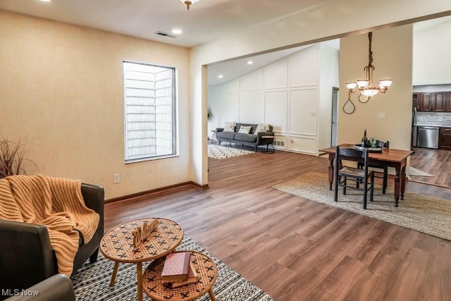 interior space with a chandelier and hardwood / wood-style flooring