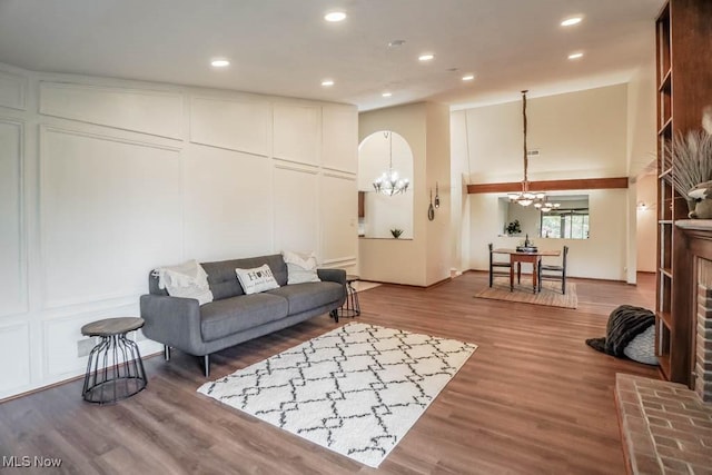 living room featuring hardwood / wood-style flooring and a notable chandelier