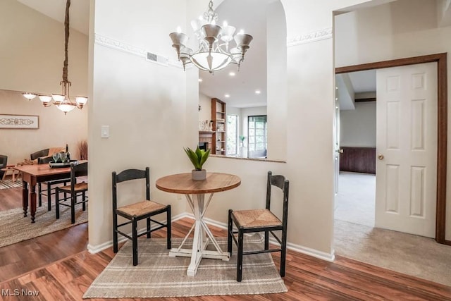 dining room featuring dark wood-type flooring and a chandelier