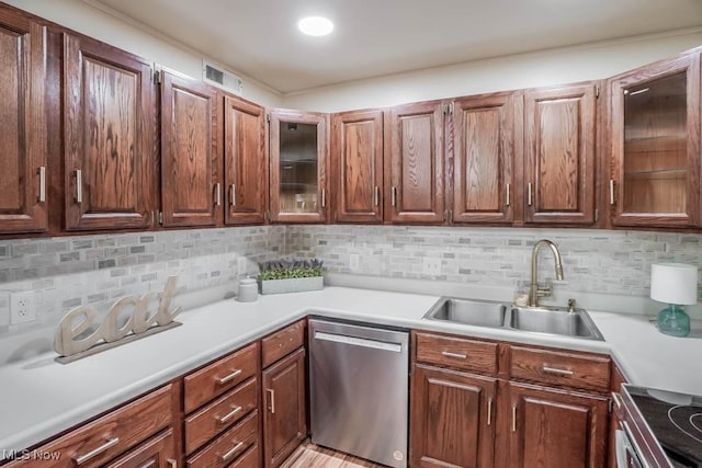 kitchen with stainless steel appliances, backsplash, and sink