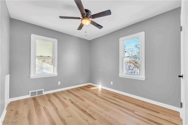 unfurnished room with ceiling fan and light hardwood / wood-style flooring