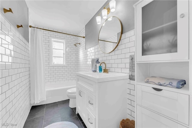 full bathroom featuring tile walls, shower / tub combo, tile patterned flooring, and toilet