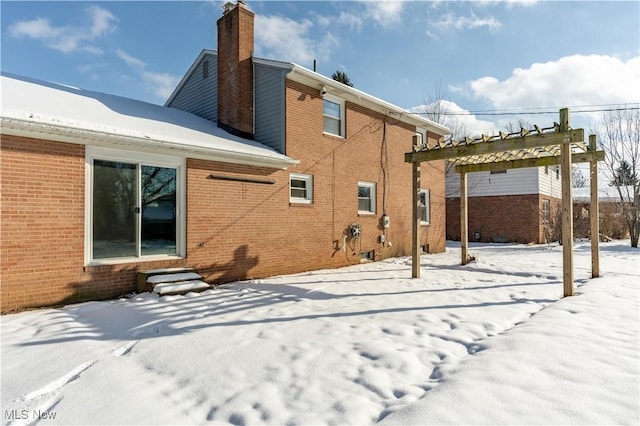 view of snow covered house