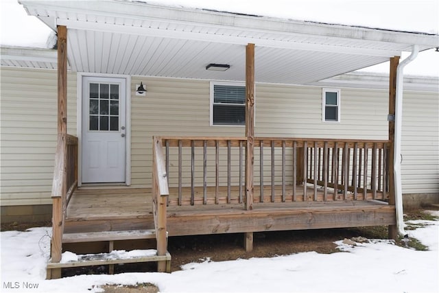 view of snow covered deck