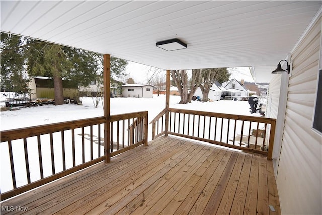 view of snow covered deck