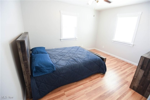 bedroom featuring ceiling fan and light wood-type flooring