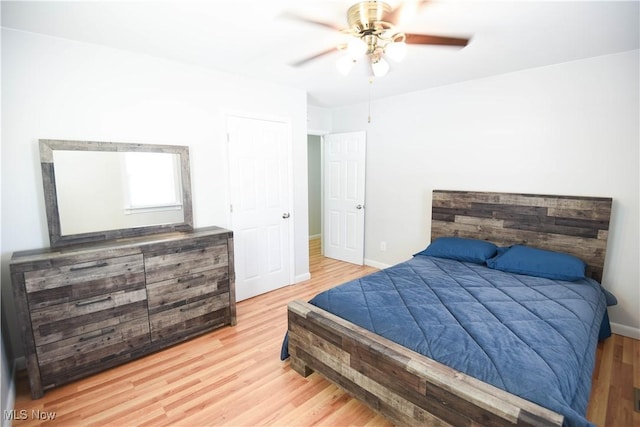 bedroom featuring ceiling fan and light hardwood / wood-style flooring