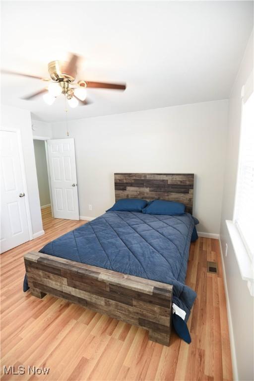 bedroom featuring ceiling fan and wood-type flooring