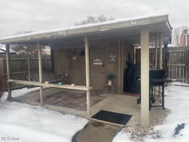 view of snow covered patio