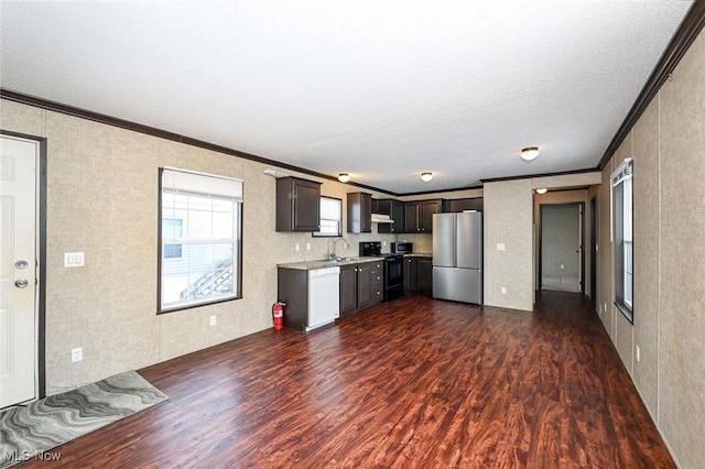 kitchen featuring stainless steel fridge, dark brown cabinets, black range with electric cooktop, crown molding, and dark wood-type flooring