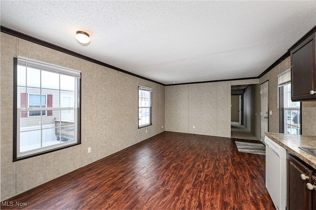 unfurnished living room featuring dark hardwood / wood-style flooring, a textured ceiling, and ornamental molding