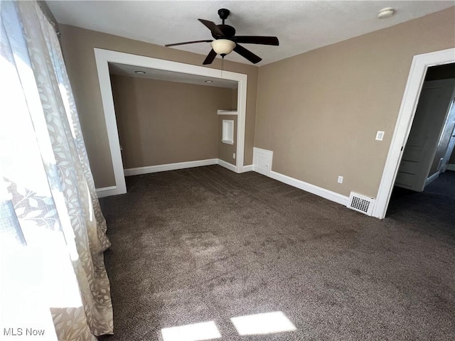 carpeted empty room with ceiling fan