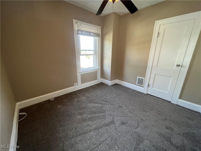 spare room with ceiling fan and carpet floors