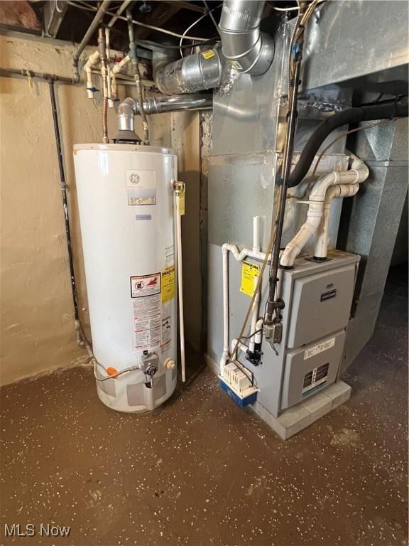 utility room with gas water heater