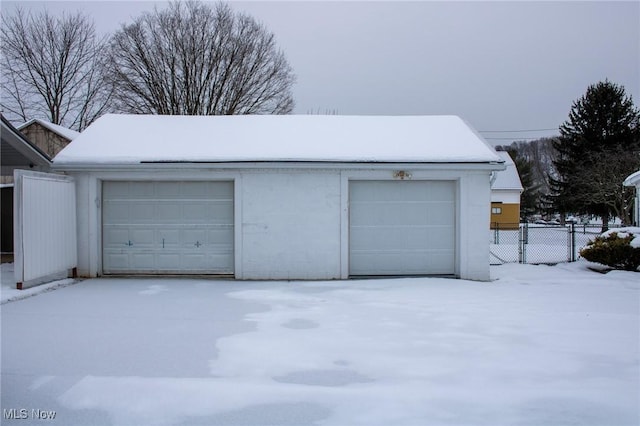 view of snow covered garage