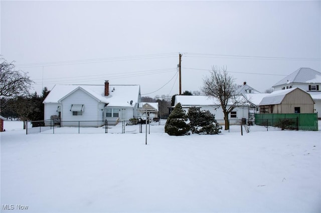 view of yard layered in snow