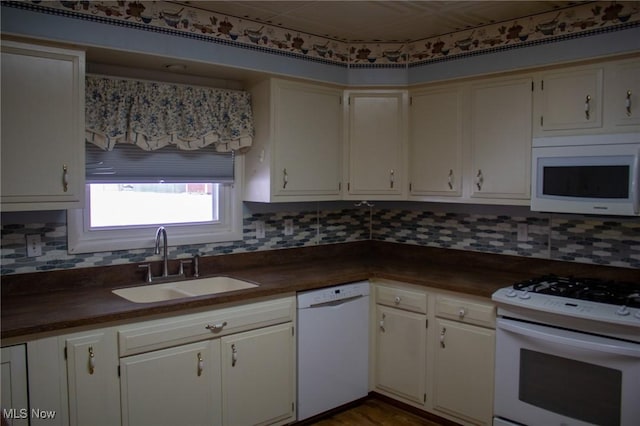 kitchen featuring sink and white appliances