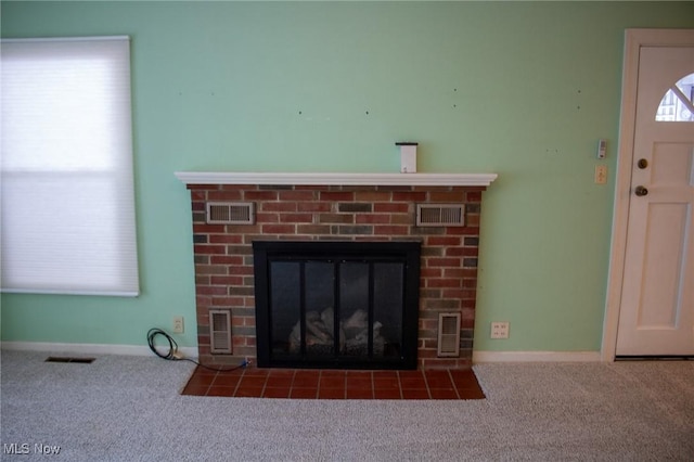 room details with a brick fireplace and carpet floors