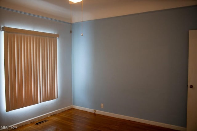 unfurnished room featuring hardwood / wood-style floors