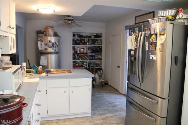 kitchen featuring stainless steel refrigerator with ice dispenser, white cabinets, stainless steel refrigerator, and kitchen peninsula