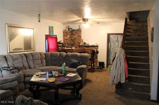 living room featuring carpet flooring, a textured ceiling, and ceiling fan