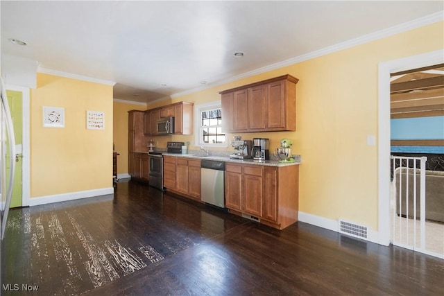 kitchen featuring ornamental molding, stainless steel appliances, dark hardwood / wood-style flooring, and sink