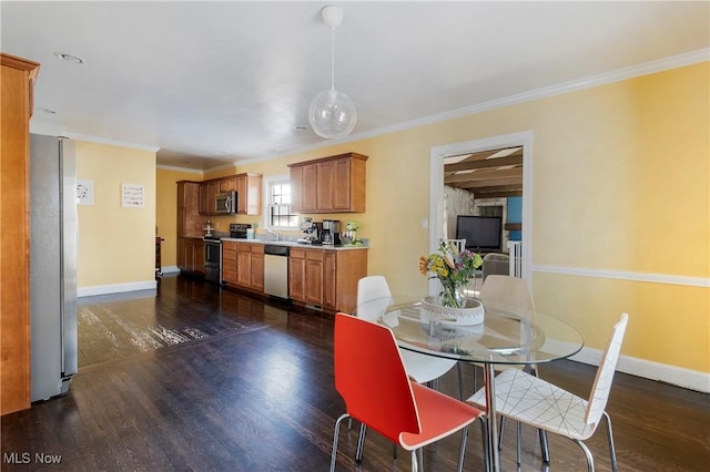 dining space featuring dark hardwood / wood-style flooring and ornamental molding