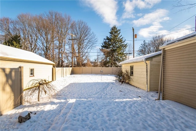 view of yard covered in snow