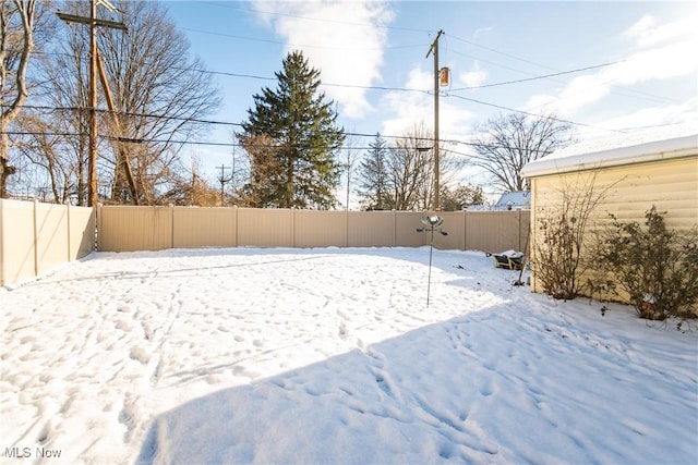 view of yard covered in snow