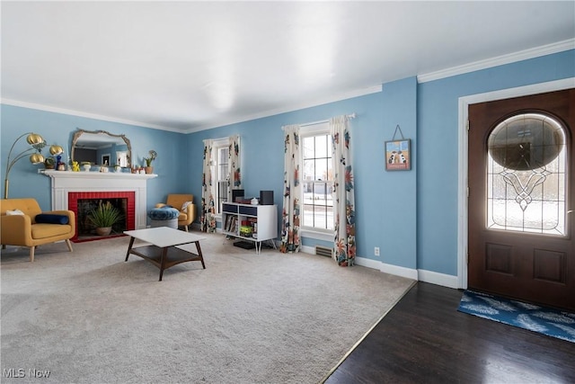 living room featuring a fireplace, crown molding, and dark hardwood / wood-style floors